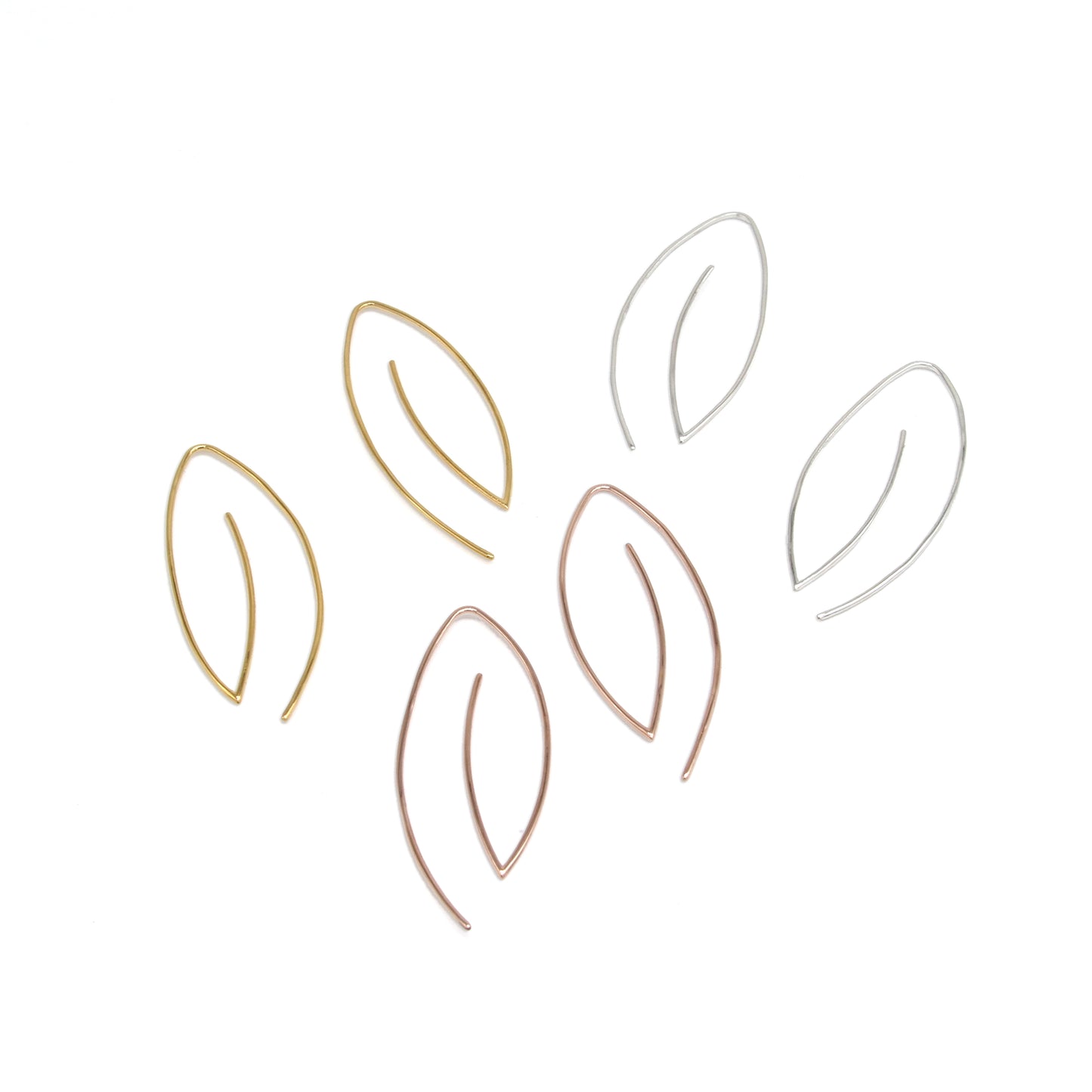 product photo of modern minimal leaf earrings with no backings on white background