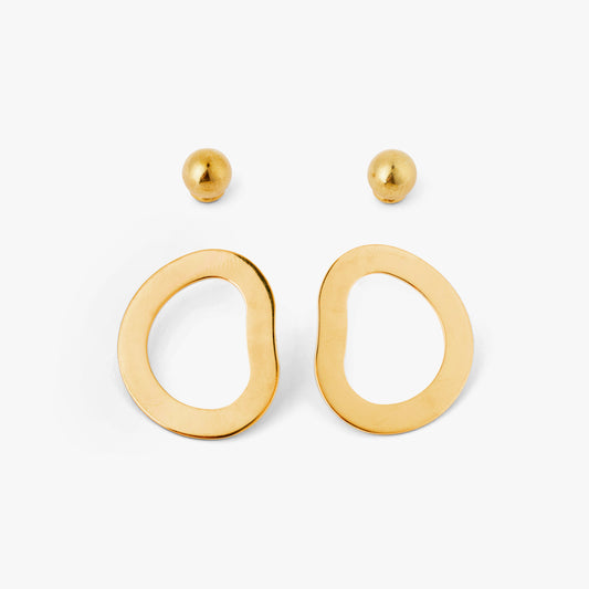 A pair of gold-colored geometric earrings with an open-oval shape accompanied by two small orb-style backings on a white background.