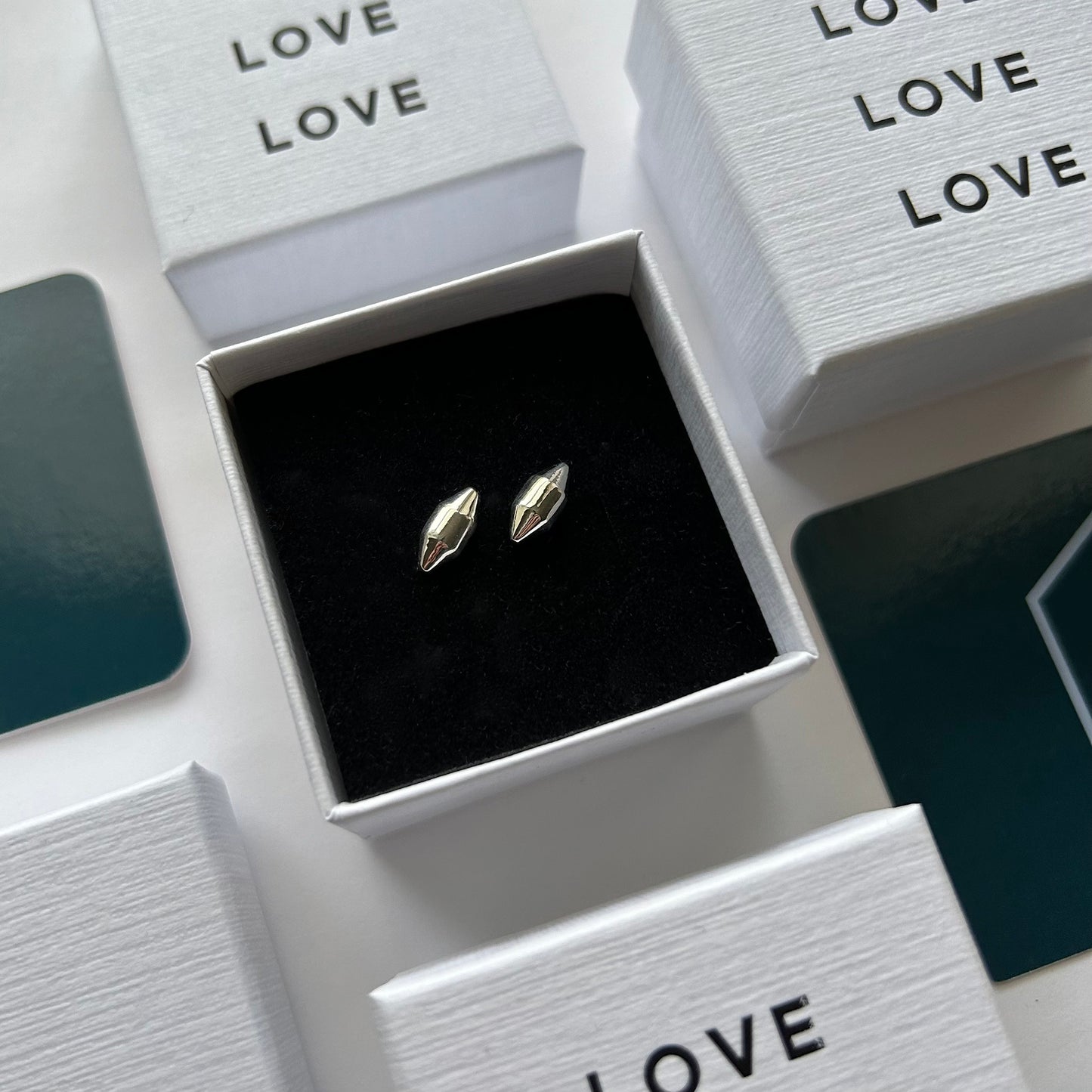 Minimal Modern Astrid Pointed Stud Earrings in jewelry box