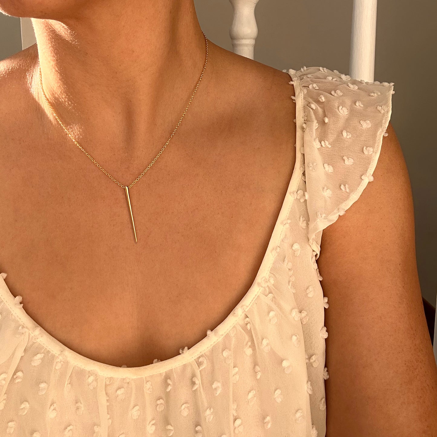 Modern Geometric Silver Spike Necklace shown on woman in white shirt