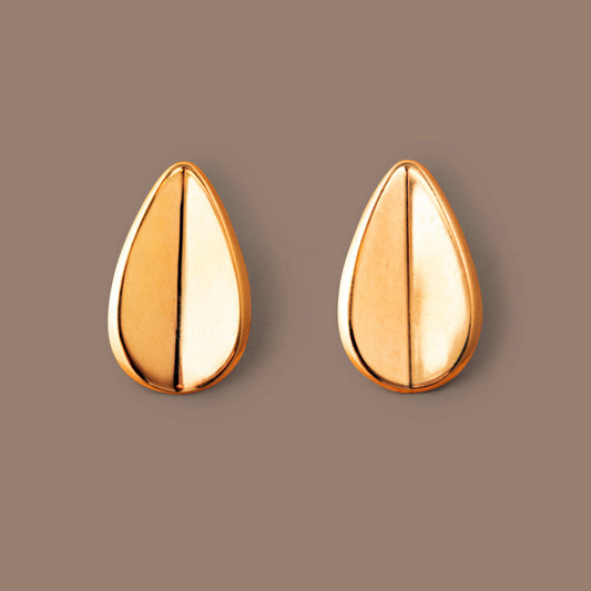 Modern Geometric Gold Water Droplet Bean Earrings shown on background view from top