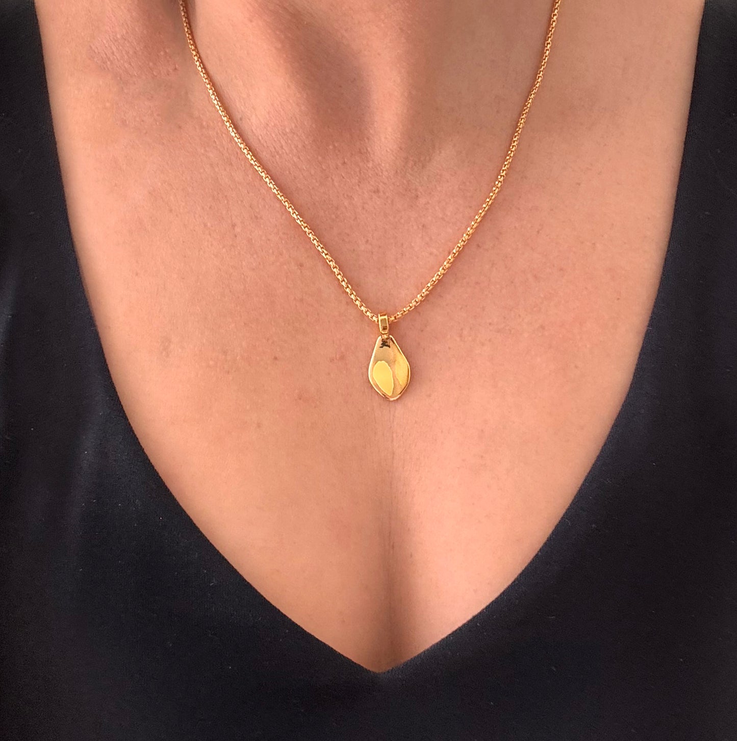 Modern Gold Rose Flower Petal Necklace on chain around woman's neck