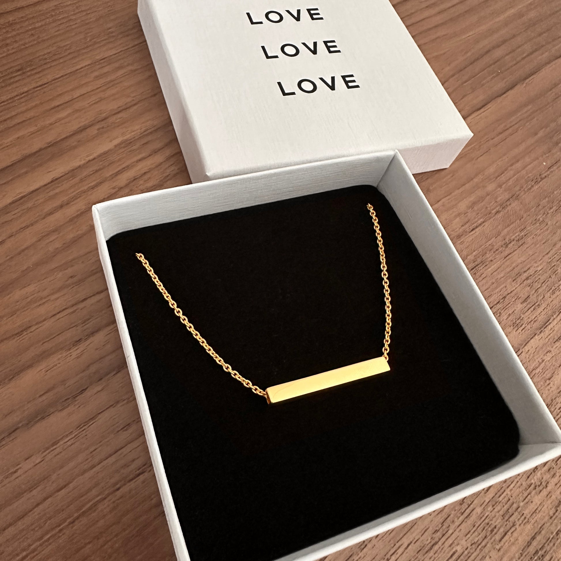Modern Linear Line Necklace in Gold, shown in jewelry box