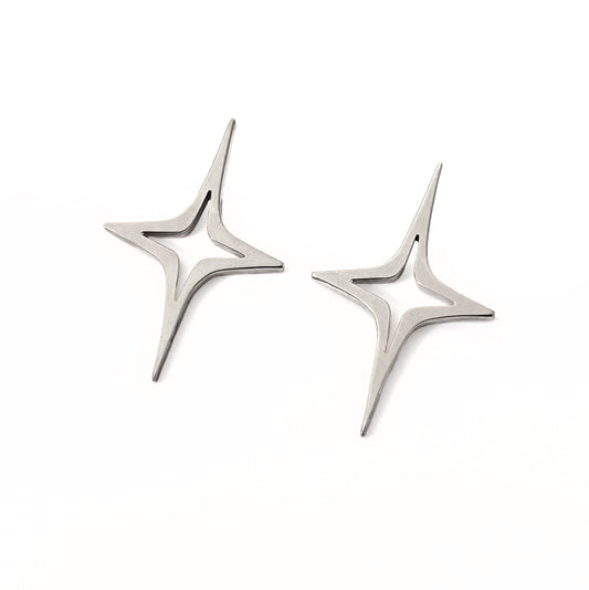 Large silver star starbursting earrings on white background