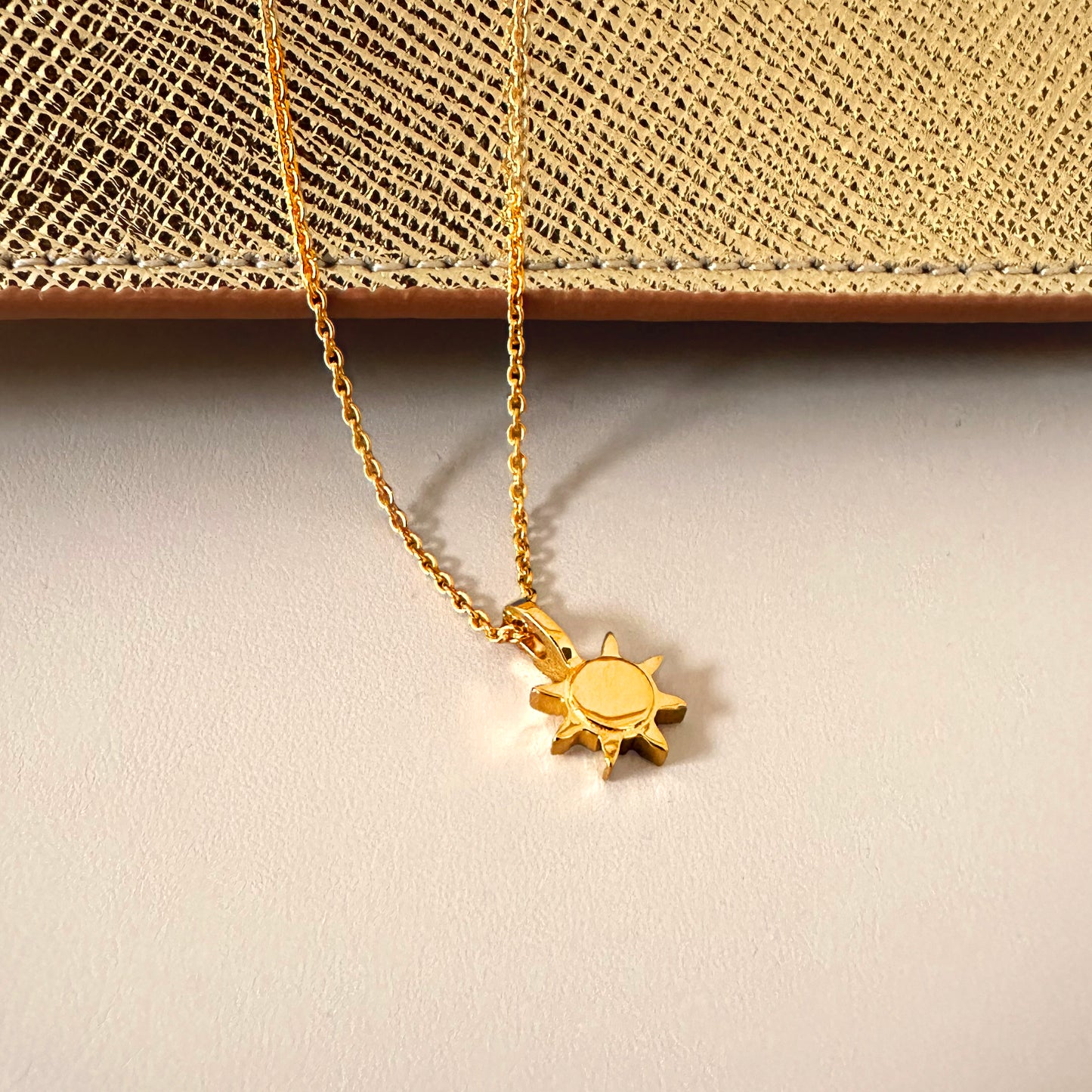 gold sunshine sun necklace product jewelry photo white gold shiny backdrop