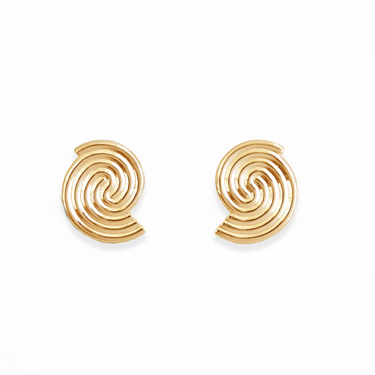 Gold spiral earrings on a white background