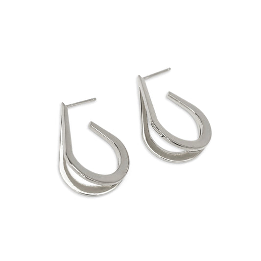 Pair of silver hoop earrings on a white background