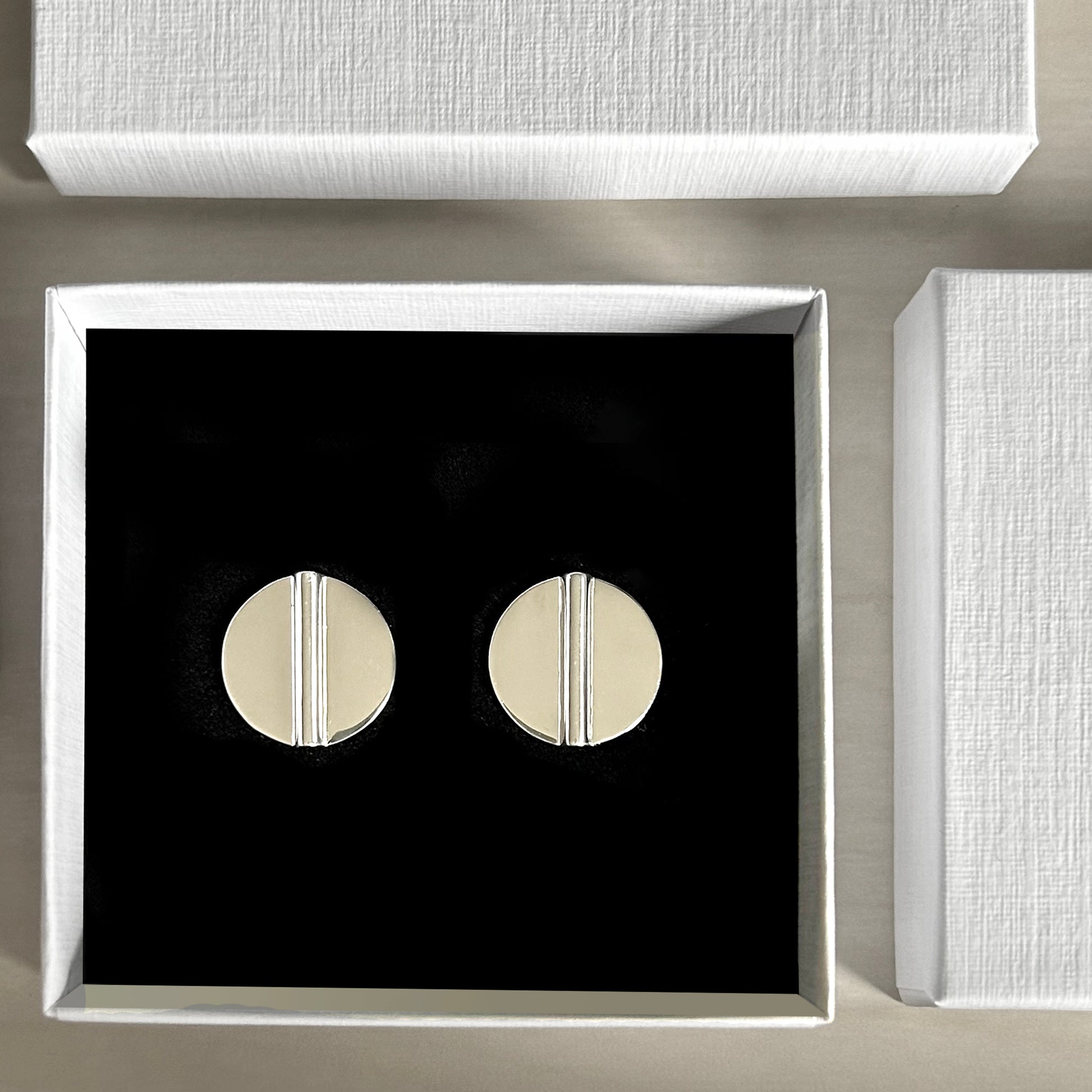 Aegis Modern Silver Coin Earrings in jewelry box