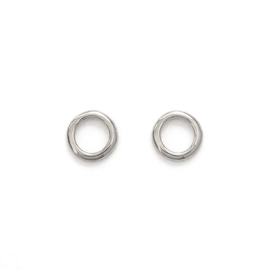 A pair of circular silver earrings on a white background