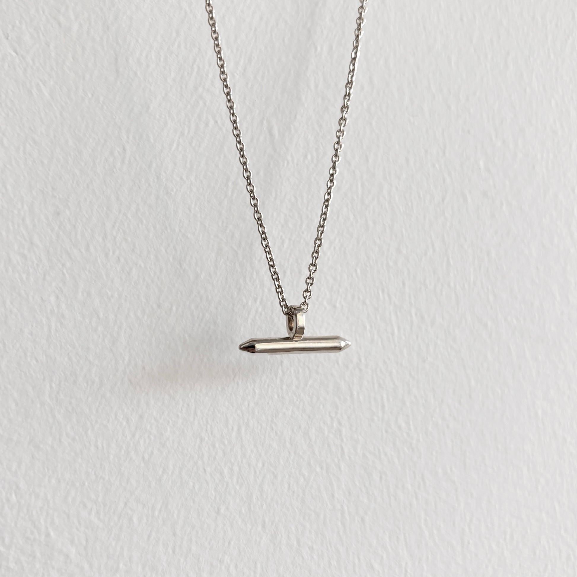Silver Linear Bar Necklace Pendant hanging on silver chain with white background