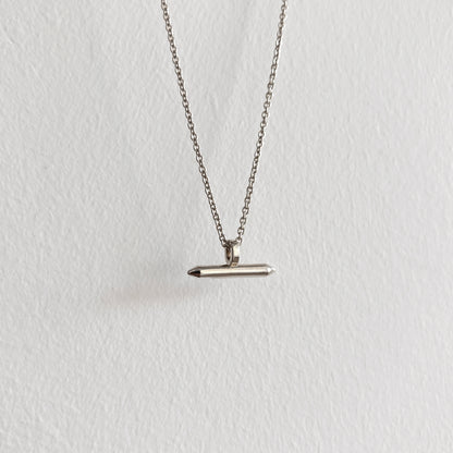 Silver Linear Bar Necklace Pendant hanging on silver chain with white background