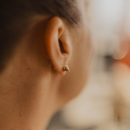 astrid pointed stud earrings on woman's ear