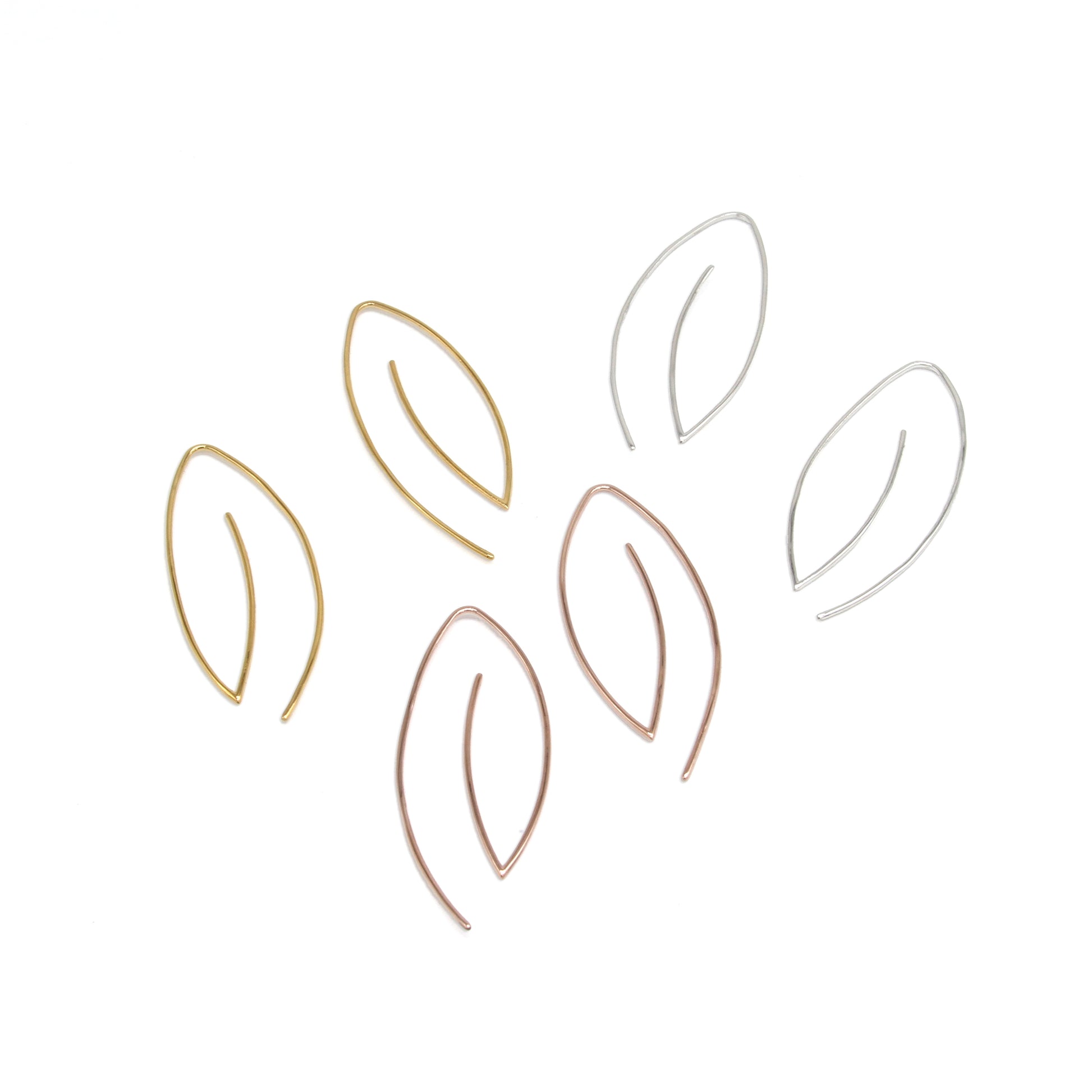 product photo of modern minimal leaf earrings with no backings on white background