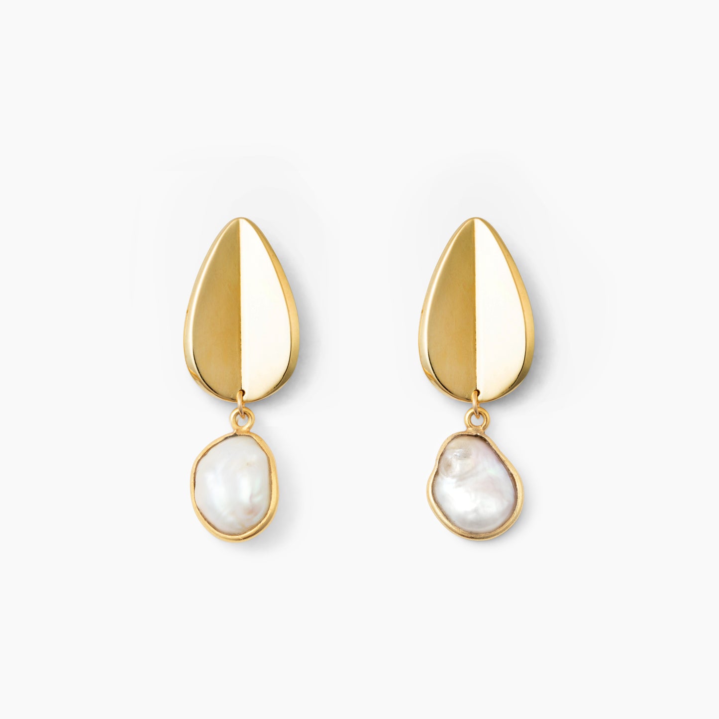 Pair of gold teardrop earrings with pearl pendants on a white background