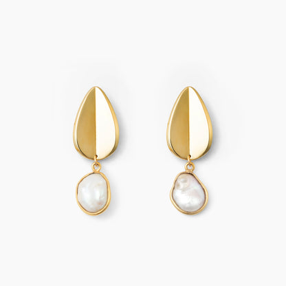 Pair of gold teardrop earrings with pearl pendants on a white background