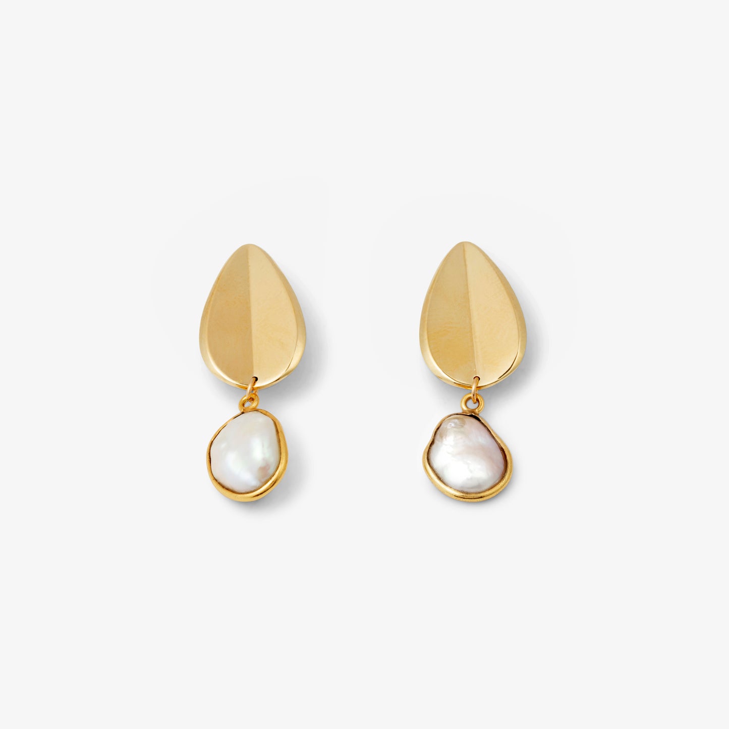 Pair of gold earrings with pearl pendants on a white background