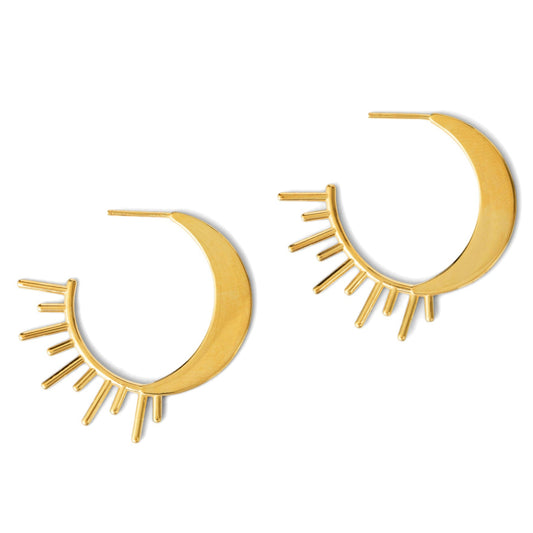 Gold crescent moon earrings with sunburst design on a white background