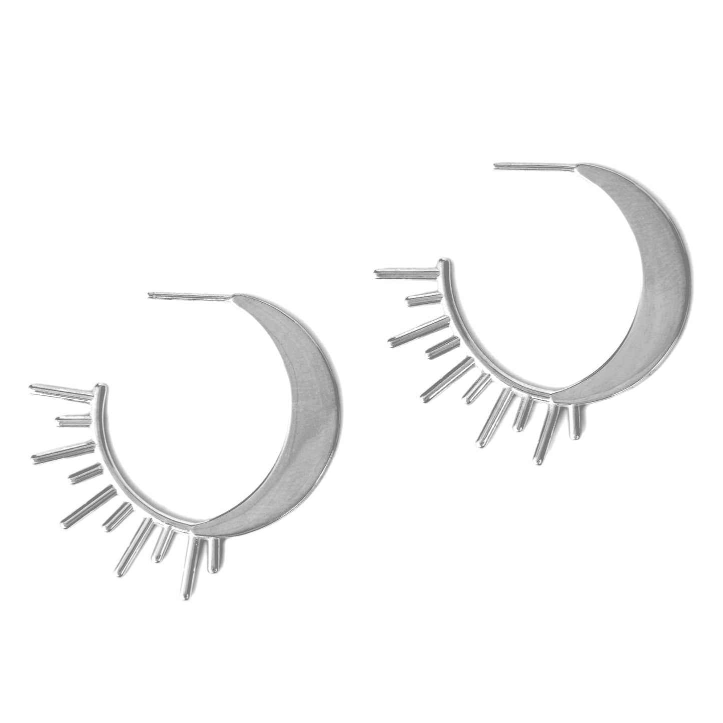 Silver hoop earrings with celestial details on a white background