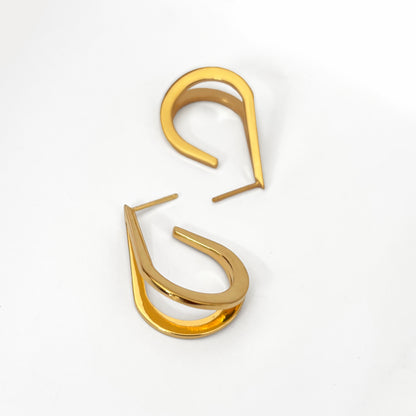 Gold hoop teardrop earrings on a white background