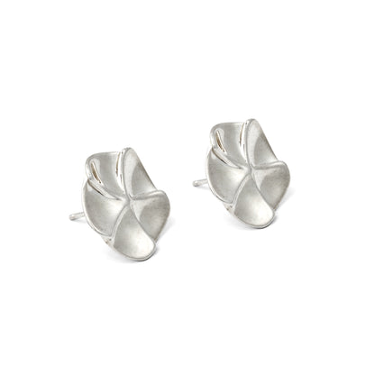 Pair of silver floral earrings on a white background