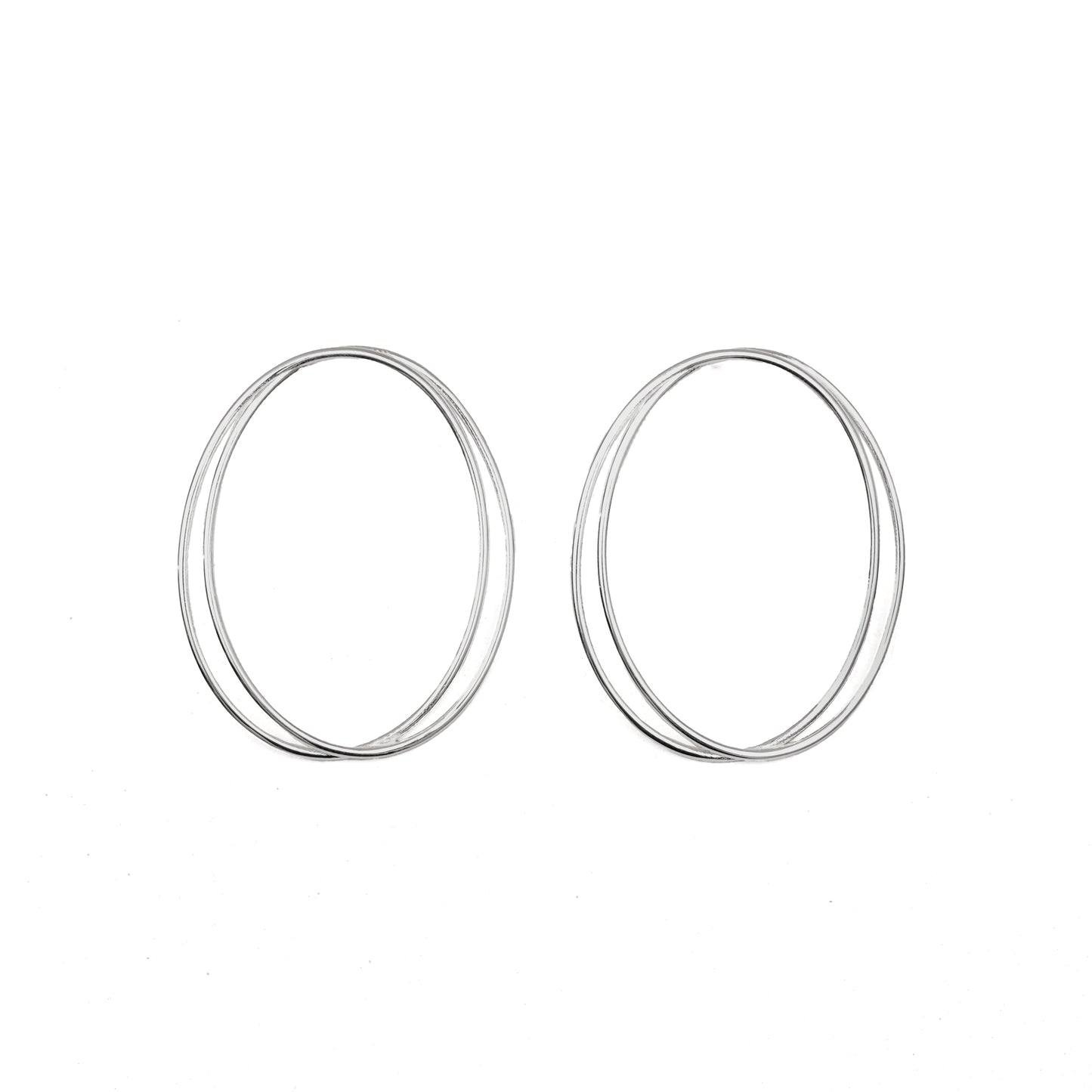 A pair of thin, oval-shaped earrings with a silver finish, displayed against a white background.