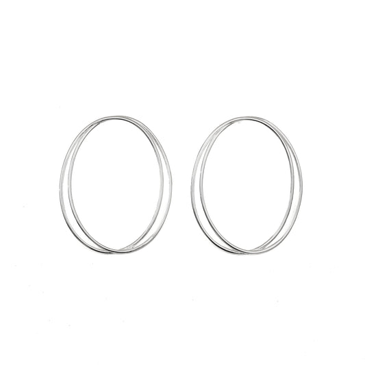 A pair of thin, oval-shaped earrings with a silver finish, displayed against a white background.