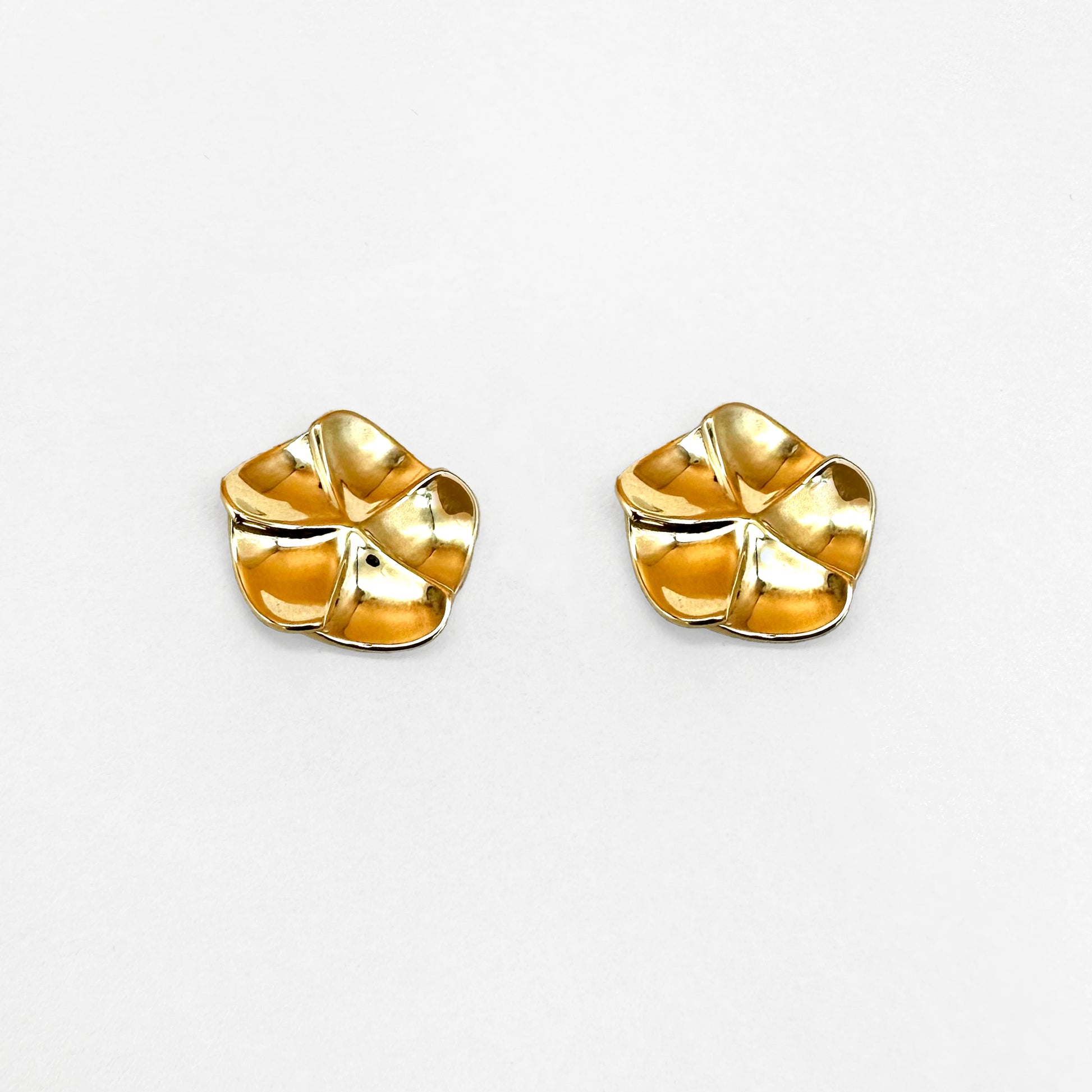 A pair of gold floral design earrings with a post-backing, inspired by flower petals.
