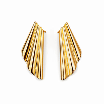 Gold fringe seashell beach earrings on a white background