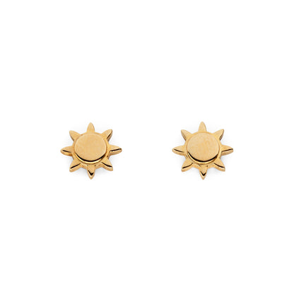 A pair of gold-colored sun stud earrings against a white background.