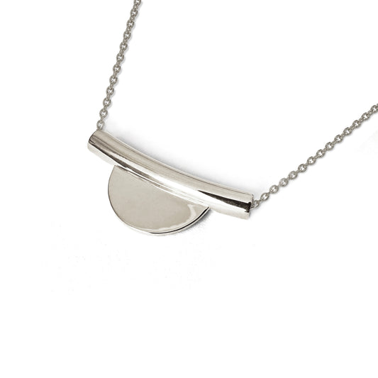 Silver necklace with a pendant on a white background
