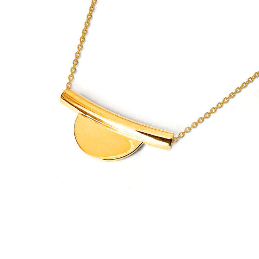 Gold necklace with a half-circle pendant on a white background