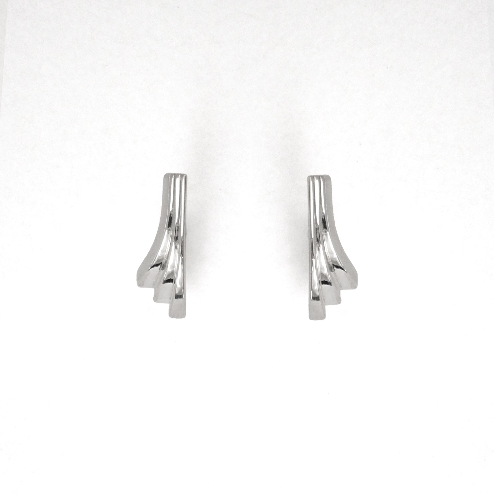 Pair of silver earrings on a white background