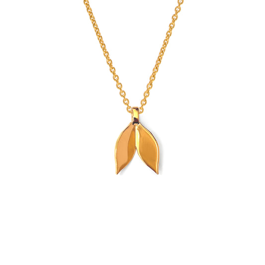 Gold necklace with a leaf-shaped pendant on a white background