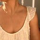 Modern Geometric Silver Spike Necklace shown on woman in white shirt