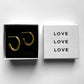 Modern Gold Hoop Aura Earrings shown in love jewelry box