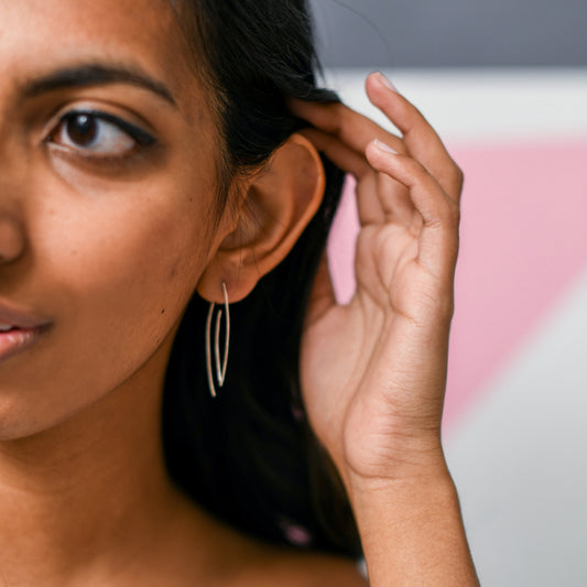 Backless Leaf Earrings, modern design shown on moman's ear