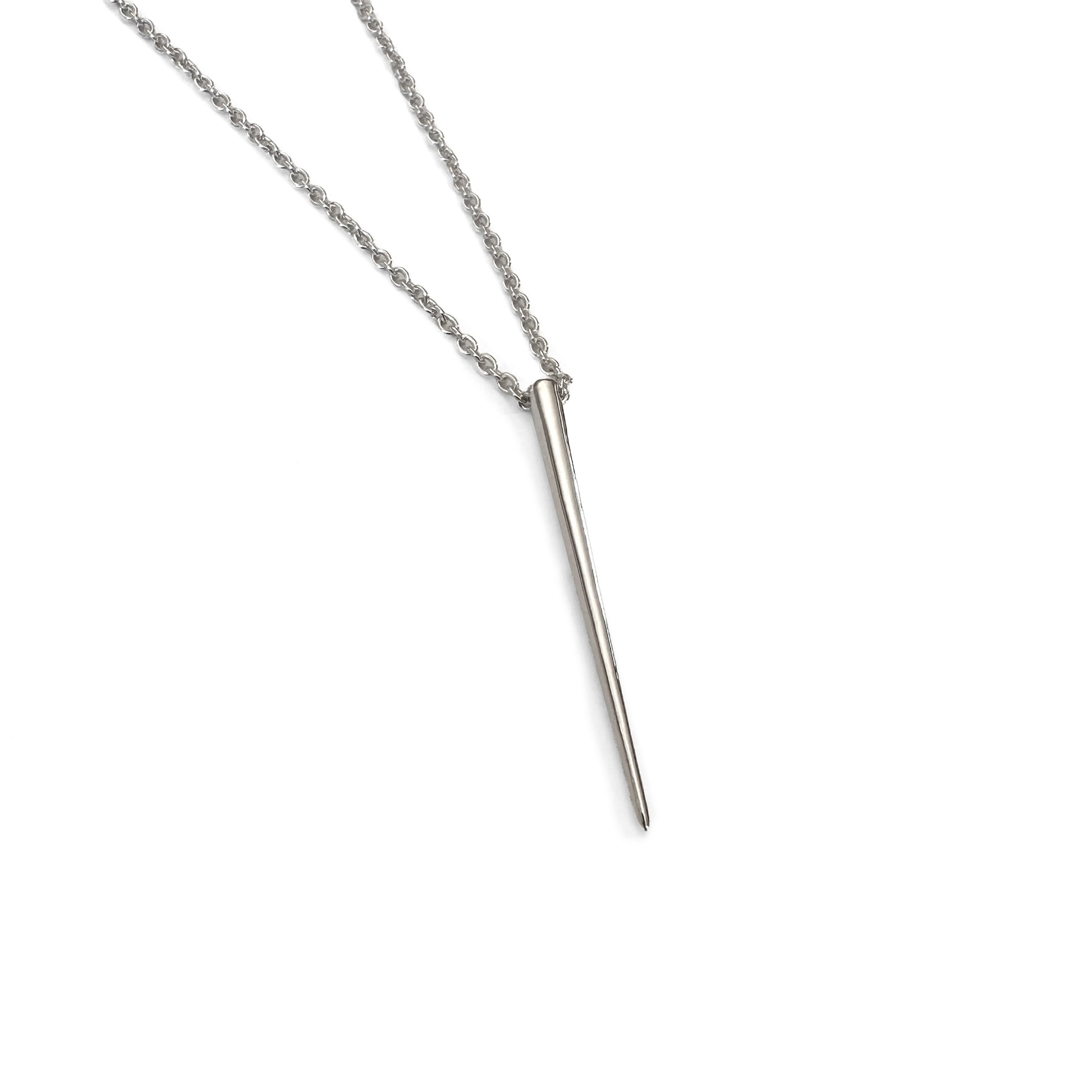 product jewelry photo of silver spike necklace on white background