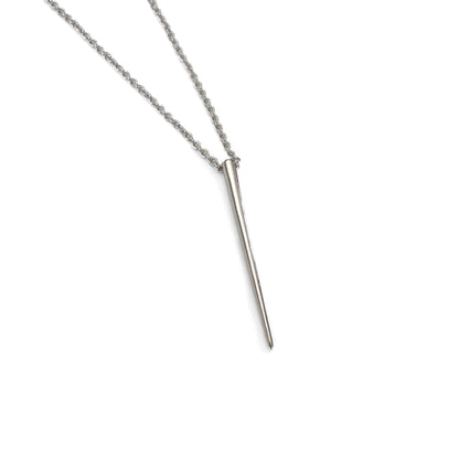 product jewelry photo of silver spike necklace on white background
