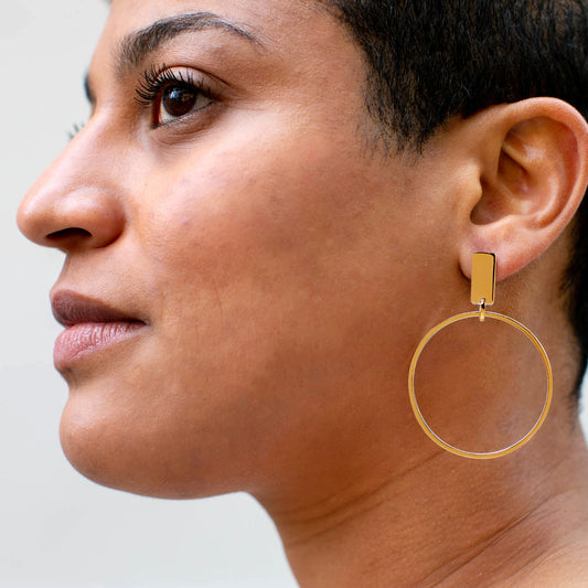 Modern Statement Hoop Earrings on woman's ear
