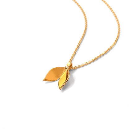 Gold Leaf Necklace Pendant on white background