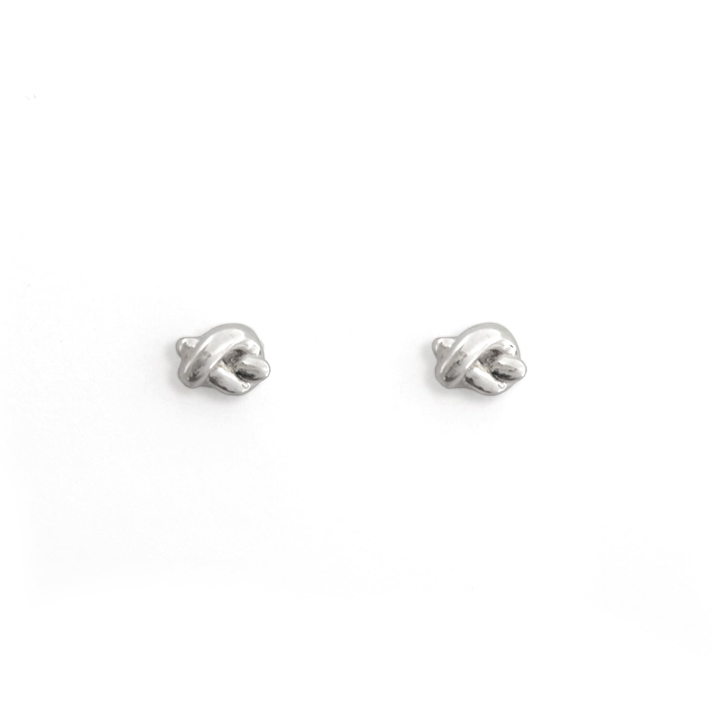 Pair of silver earrings on a white background