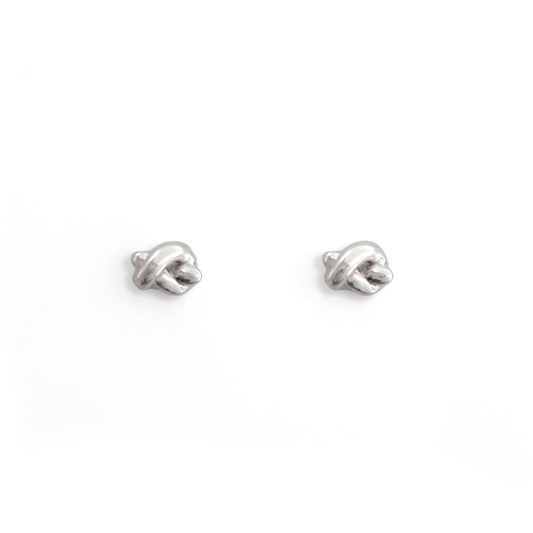 Pair of silver earrings on a white background