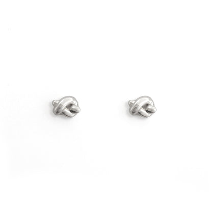 Pair of silver earrings on a white background