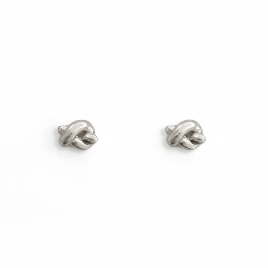 Pair of silver earrings on a white background