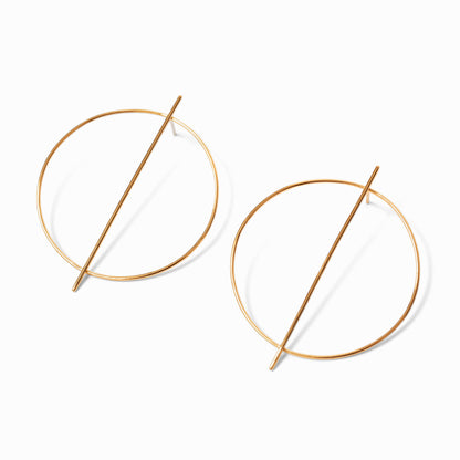 A pair of gold-colored hoop earrings with a minimalist line design