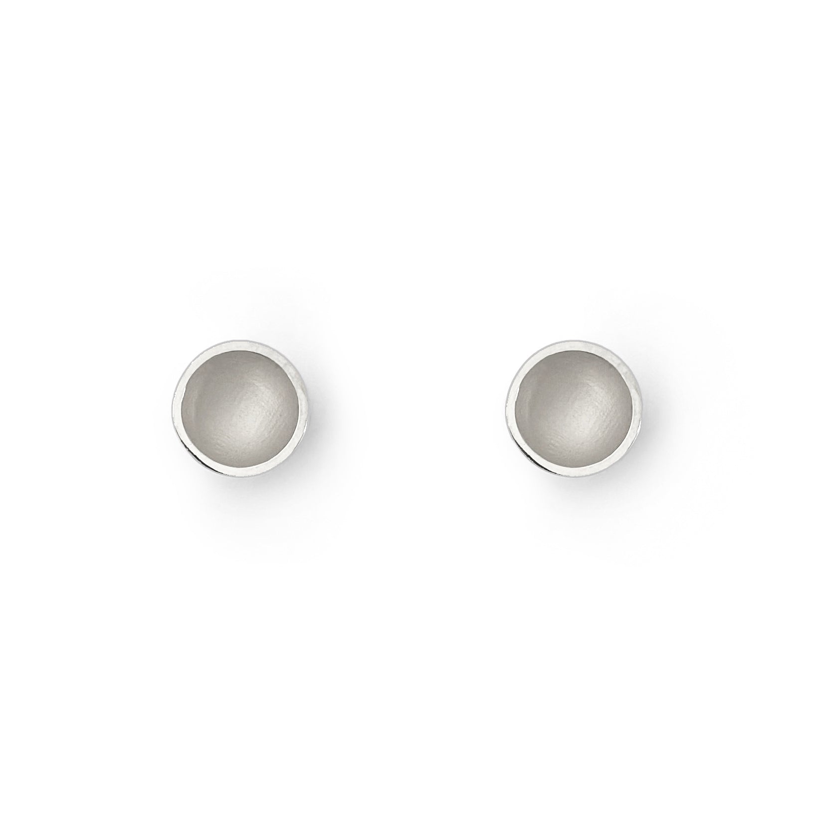 Two small orb earrings on a white background