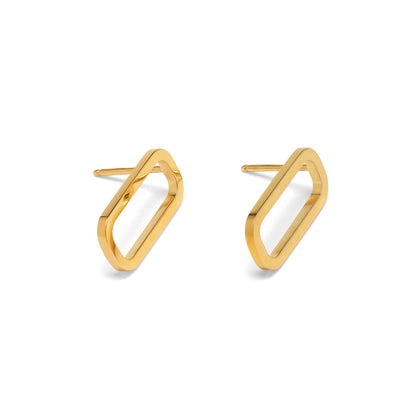Gold geometric earrings on a white background