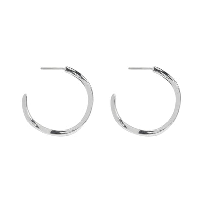 Pair of silver hoop earrings on a white background