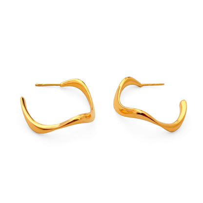Gold hoop earrings on a white background