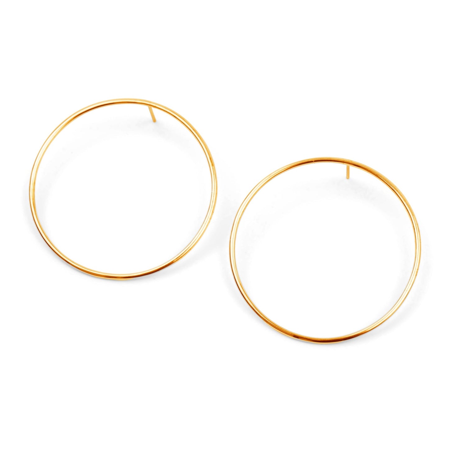 modern round circle earrings in gold on white background